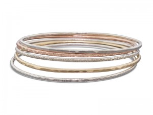 Set of 5 gold and silver stacking textured and hammered bangles