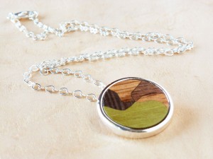 Pendant with Wood inlay and silver plated.