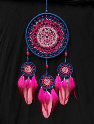 Large blue and pink dreamcatcher with unique woven web