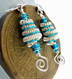 Coiled wire earrings with peacock blue accents and open spirals Coiled wire earrings with peacock blue accents and open spirals